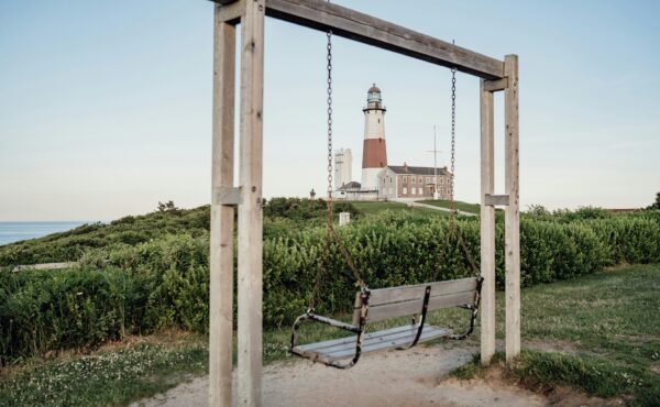 Photo of beach with light house